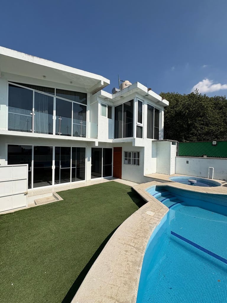 Modern white two-story house with swimming pool