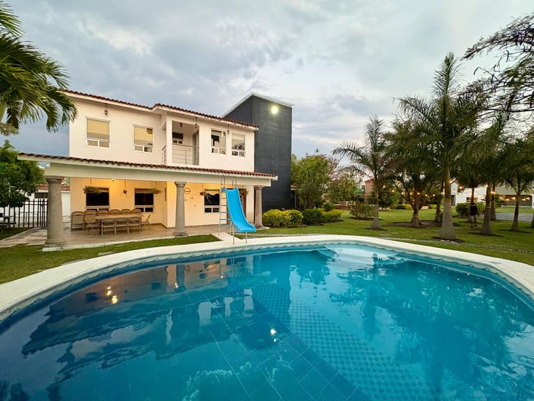 Modern two-story house with yellow and cream exterior