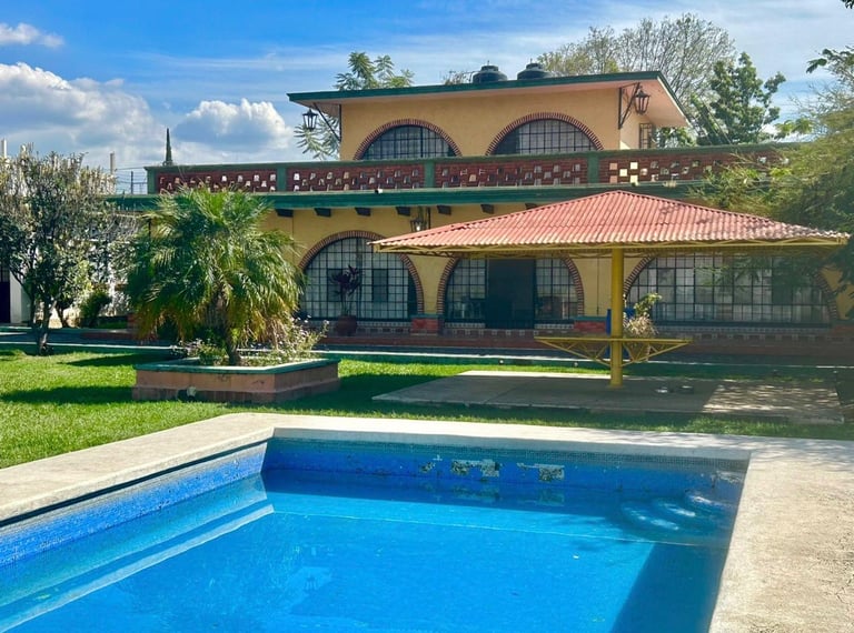 Yellow Mediterranean-style villa with swimming pool